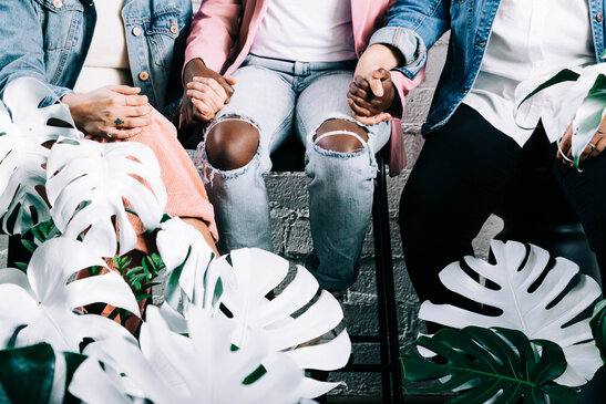 Young People Holding Hands in Prayer