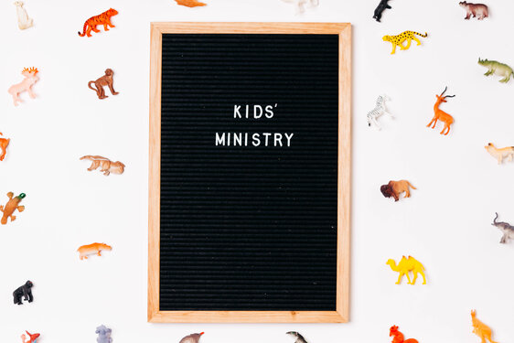 Kids' Ministry Letter Board Surrounded by Toy Animals