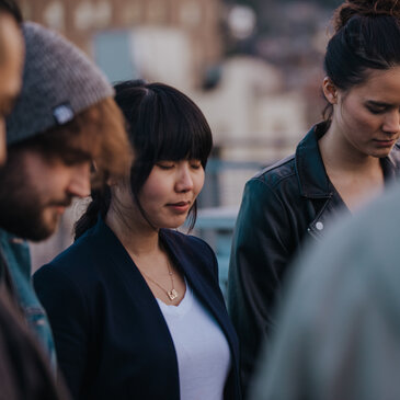 A Group of People Praying Together