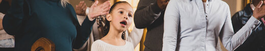 Child Singing During Worship