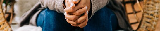 Woman's Hands Folded in Prayer