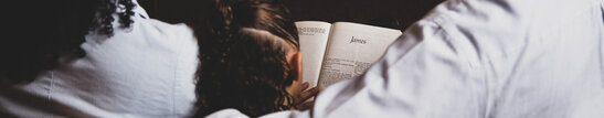 A Young Family Reading the Bible Together
