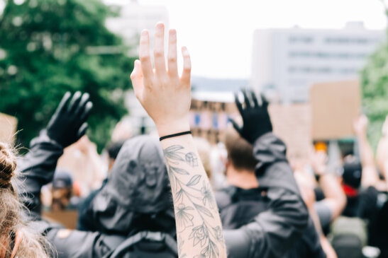 Peaceful Protesters with Their Hands Up