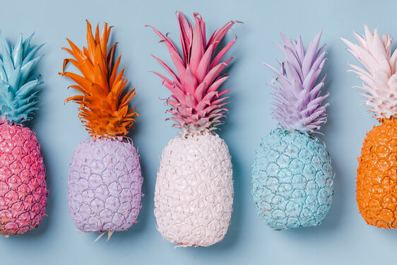 Colorful Pineapples on Blue Background