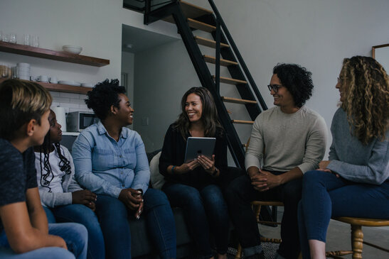 Woman Teaching Small Group of People