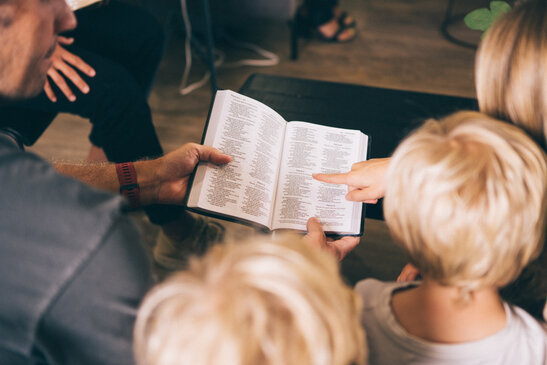 Young Family doing Devotions Together