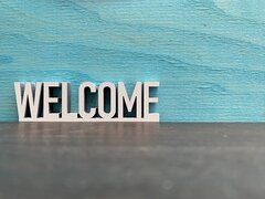 Welcome sign on blue background