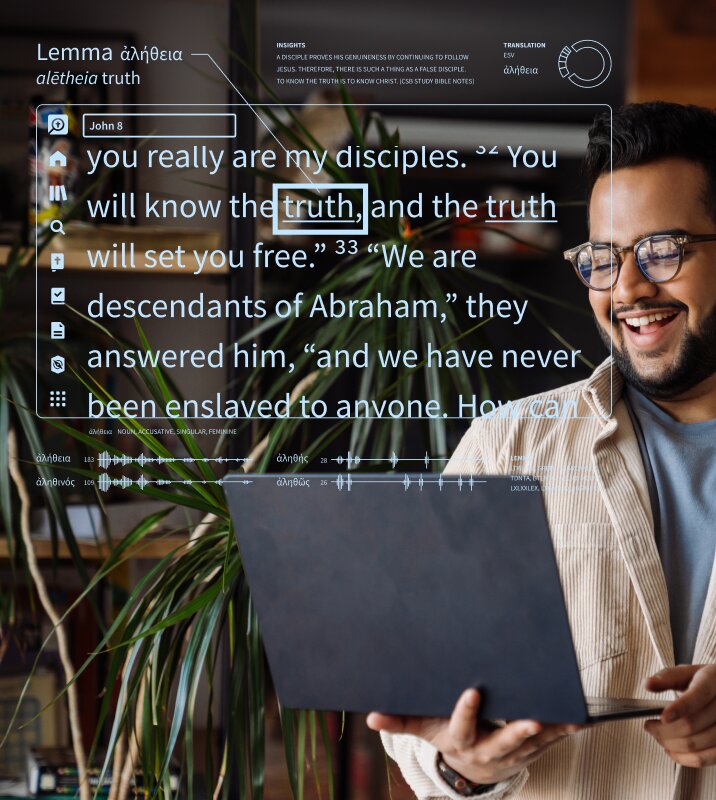 Man Using Laptop and Smiling