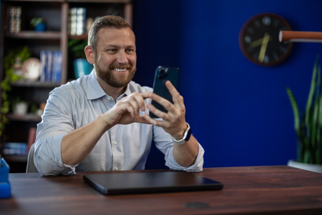 Happy Man using Phone