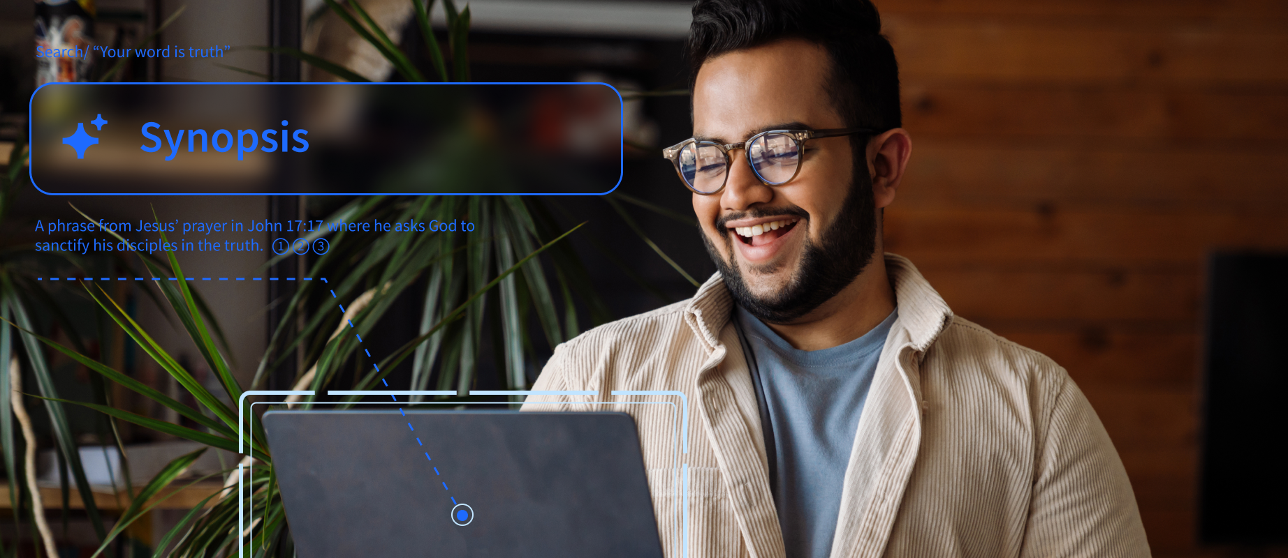 Man Using Laptop and Smiling