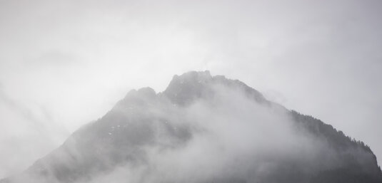Fog over snowy mountian