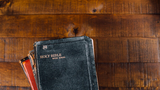 Stack of Bibles on wood