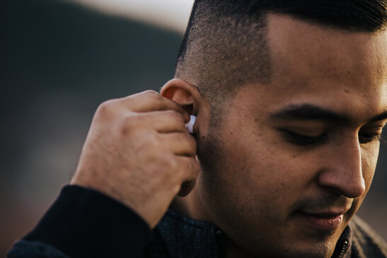 Man Putting in Air Pods