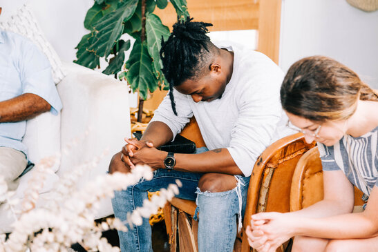 Small Group Members Praying
