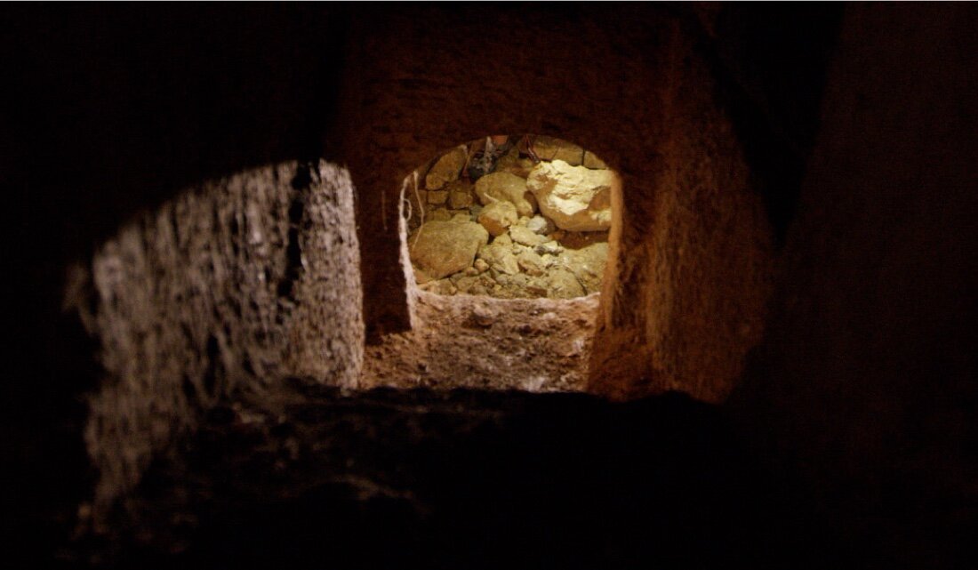 The entrance to the Tomb of the Shroud is actually an entrance to its basement. Most of the elite tombs on this hillside would have had superstructures that looked like small temples.