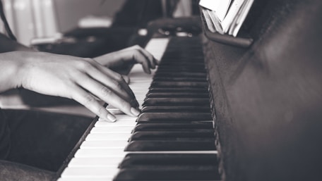 Female pianist hands in black and white