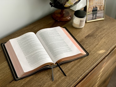 An ESV Bible sits open on a table. 