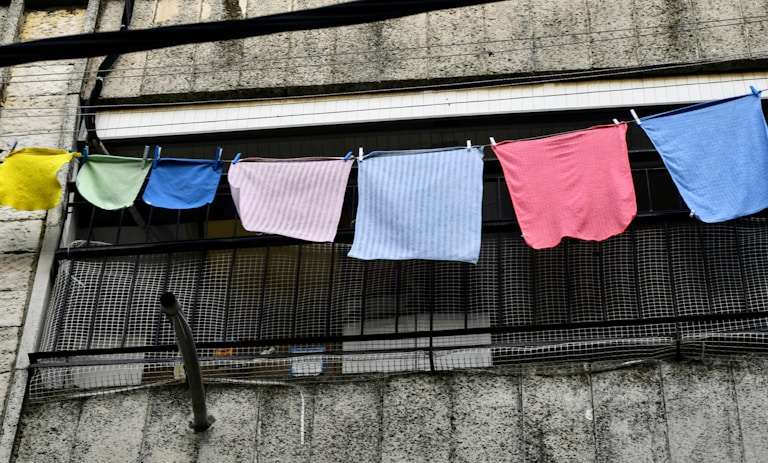 I was walking around the city and a bright colors caught my eye, looked up and captured this cloth line full of color rags.
