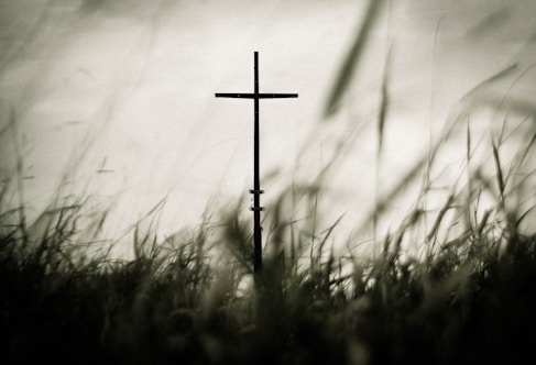 Cross in grassy field