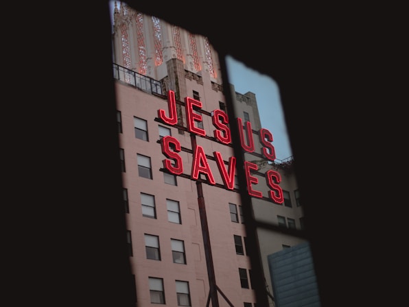 I’ve seen this sign photographed a million times but during a recent walk downtown I noticed a parking garage near the sign. I walked 8 flights of stairs and found this little window looking out to the Jesus Saves sign.