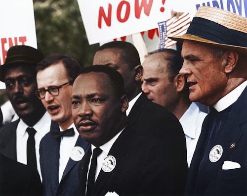 Caption reads, "[Civil Rights March on Washington, D.C. [Dr. Martin Luther King, Jr. and Mathew Ahmann in a crowd.], 8/28/1963" Original black and white negative by Rowland Scherman. Taken August 28th, 1963, Washington D.C, United States (The National Archives and Records Administration). Colorized by Jordan J. Lloyd. U.S. Information Agency. Press and Publications Service. ca. 1953-ca. 1978. https://catalog.archives.gov/id/542015