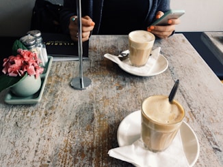 Smartphone user over latte