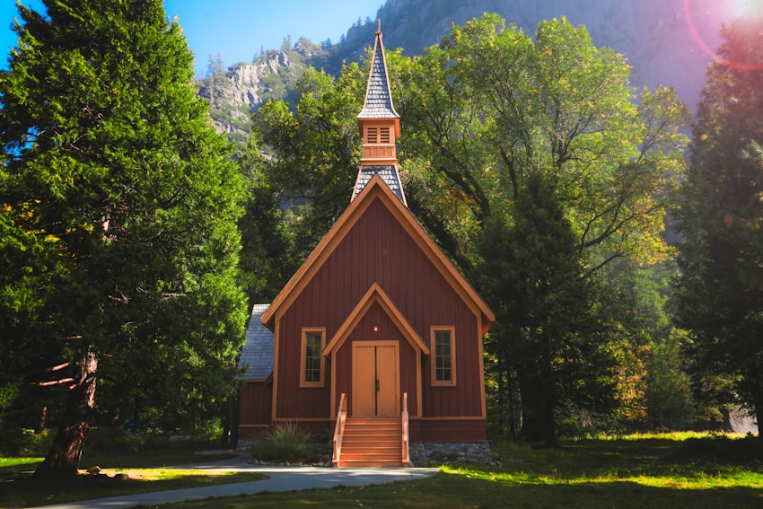 A sunny afternoon photo of the beautiful Yosemite Valley Church. Gorgeous architecture in a lush forest setting with views that take your breath away.