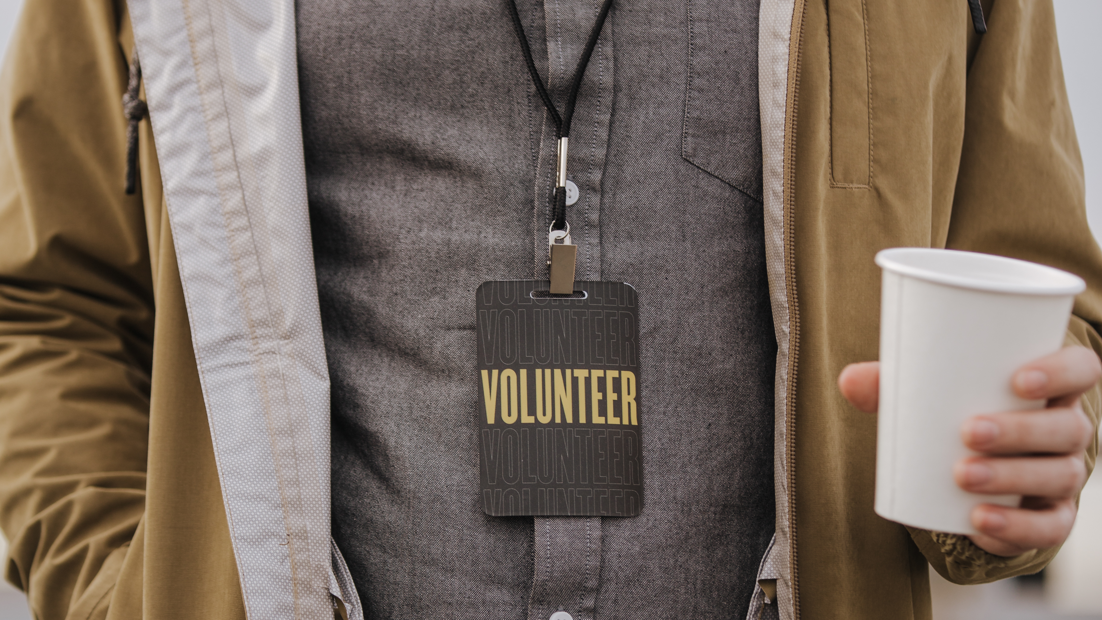 Man in Volunteer Badge