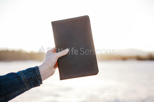 Hand in Frame Holding Bible