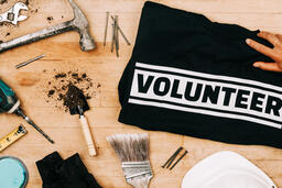 Hand Grabbing a Volunteer Shirt  image 2