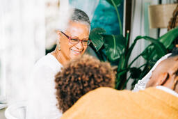 Grandmother Laughing with Grandchild at the Thanksgiving Table  image 5