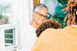 Grandmother Laughing with Grandchild at the Thanksgiving Table  image 2