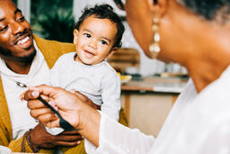Grandmother Interacting with Grandchild at the Thanksgiving Table  image 3