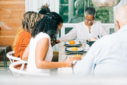 Family Praying Together Before the Thanksgiving Meal  image 1