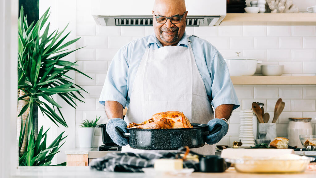 Man Holding Thanksgiving Turkey large preview