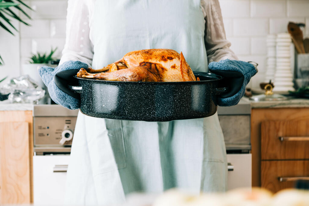 Woman Holding Thanksgiving Turkey large preview