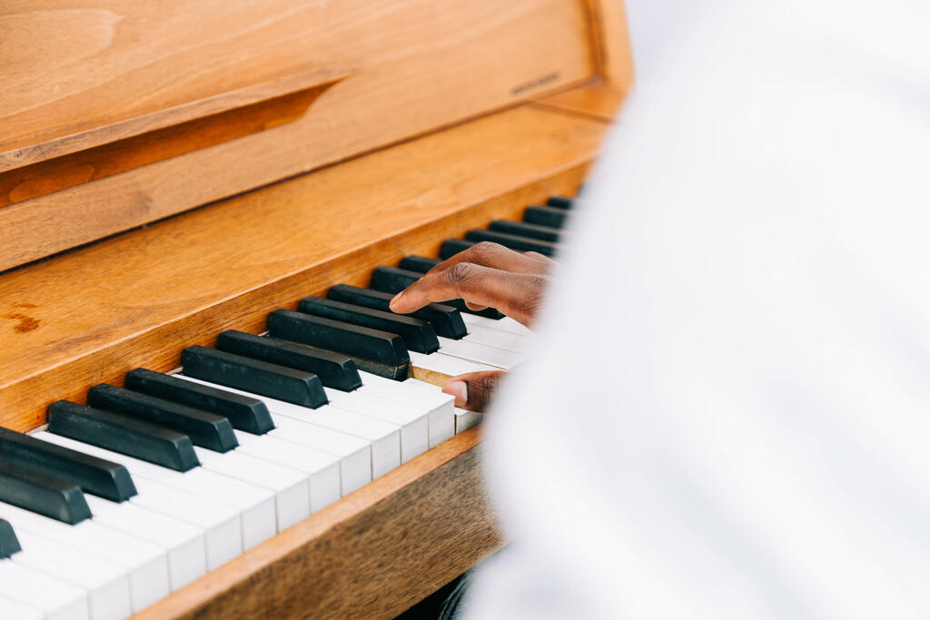 Man's Hand on Keys of Piano large preview