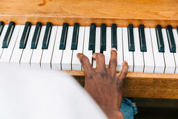 Man's Hand on Keys of Piano  image 2