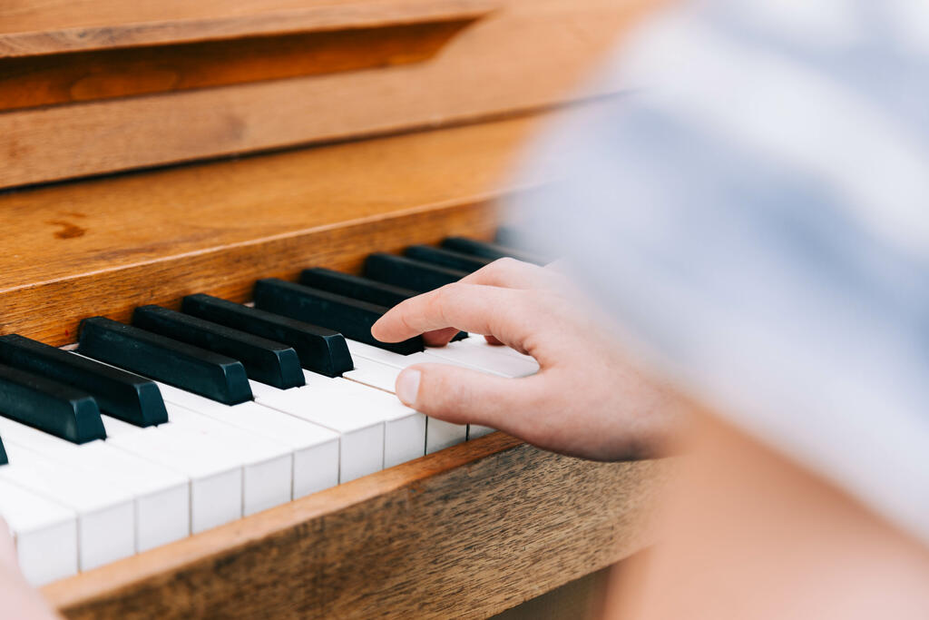 Woman's Hands on Keys of Piano large preview