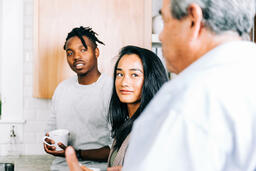Small Group Members having Conversation in the Kitchen with Coffee  image 1