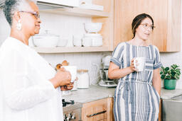 Women having Conversation with Coffee in the Kitchen  image 1