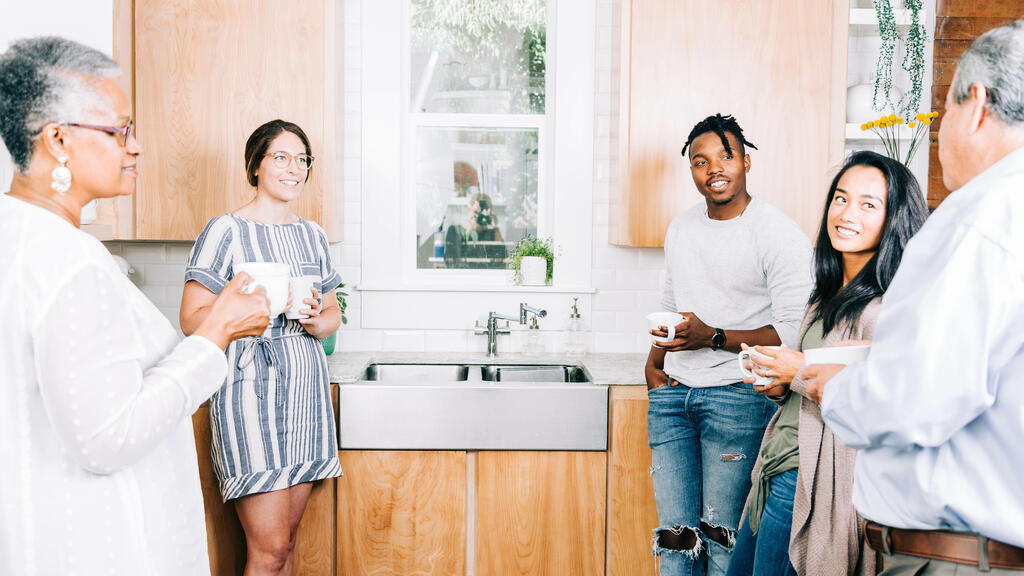 Small Group Members having Conversation in the Kitchen with Coffee large preview