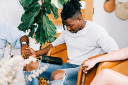 Small Group Members Holding Hands in Prayer  image 1