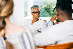 Woman Listening during Discussion at Small Group  image 1