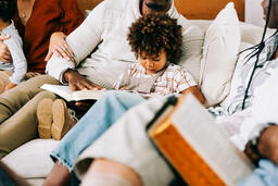 Child Seated with Family during Small Group  image 1