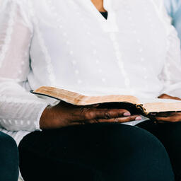 Woman Reading from Open Bible at Small Group  image 2