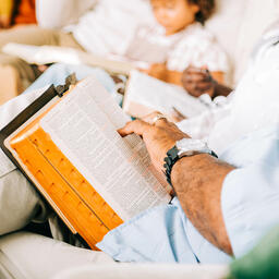 Small Group Member with an Open Bible on his Lap  image 2