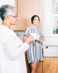 Small Group Members having Conversation in the Kitchen with Coffee  image 2