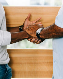 Men Shaking Hands at Entrance of Home  image 3