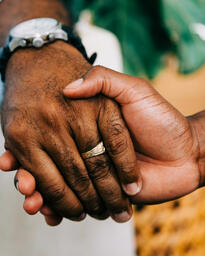 Two Small Group Members Holding Hands in Prayer  image 3